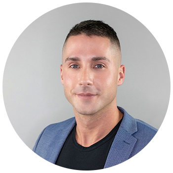 Professional headshot of man with short hair