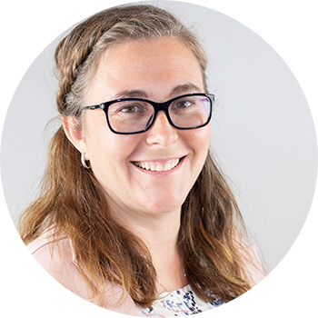 Professional headshot of woman with long hair