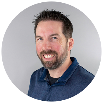 Professional headshot of man smiling