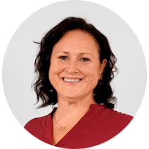Professional headshot of woman wearing red top
