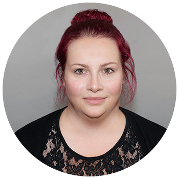 Professional headshot of woman on neutral background