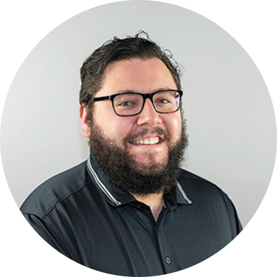 Professional headshot of man wearing glasses